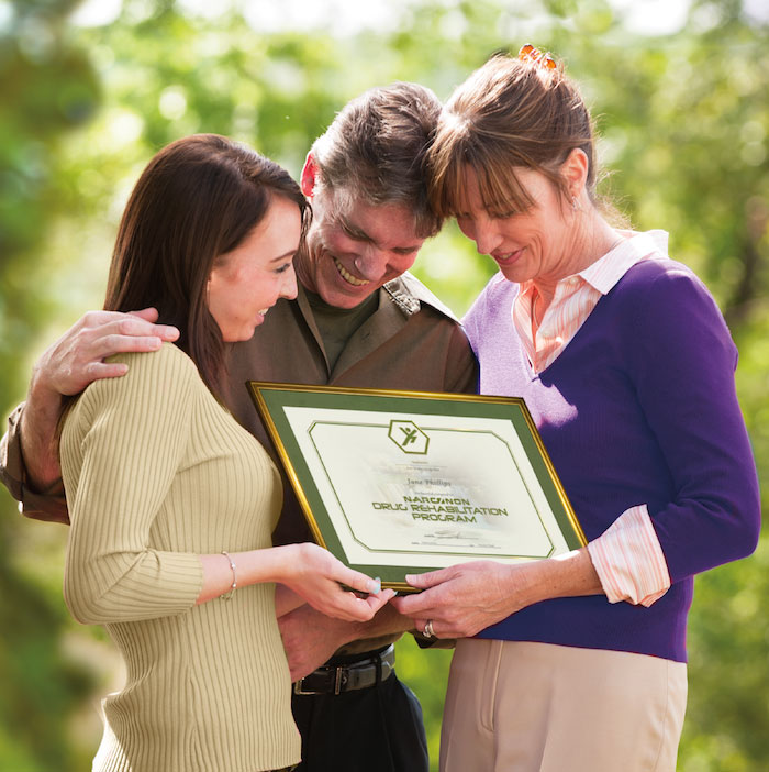 Happy Narconon Graduate with her parents.