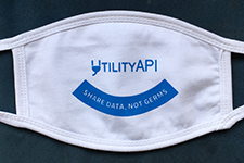 white UtilityAPI mask with "Share data, not germs" on it
