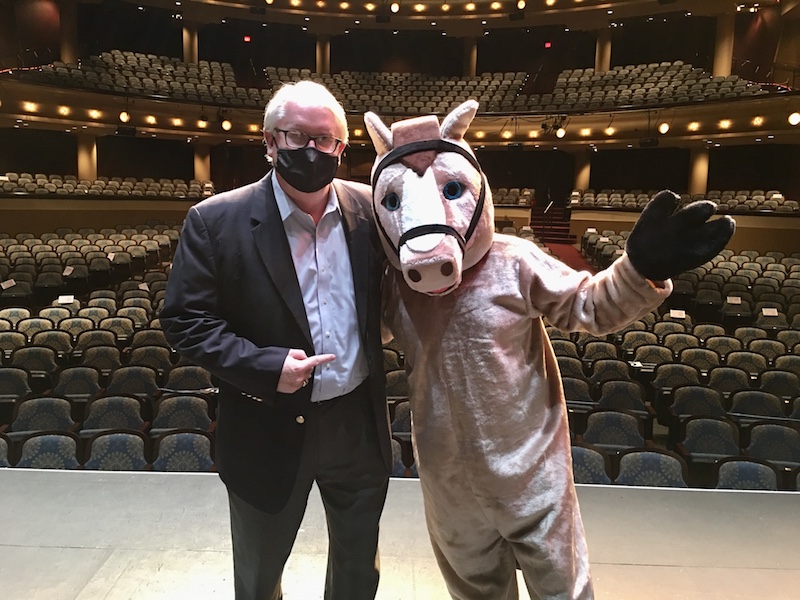 Executive Director Norman Easterbrook and Steeplechase mascot Horace the Horse on the RiverCenter stage