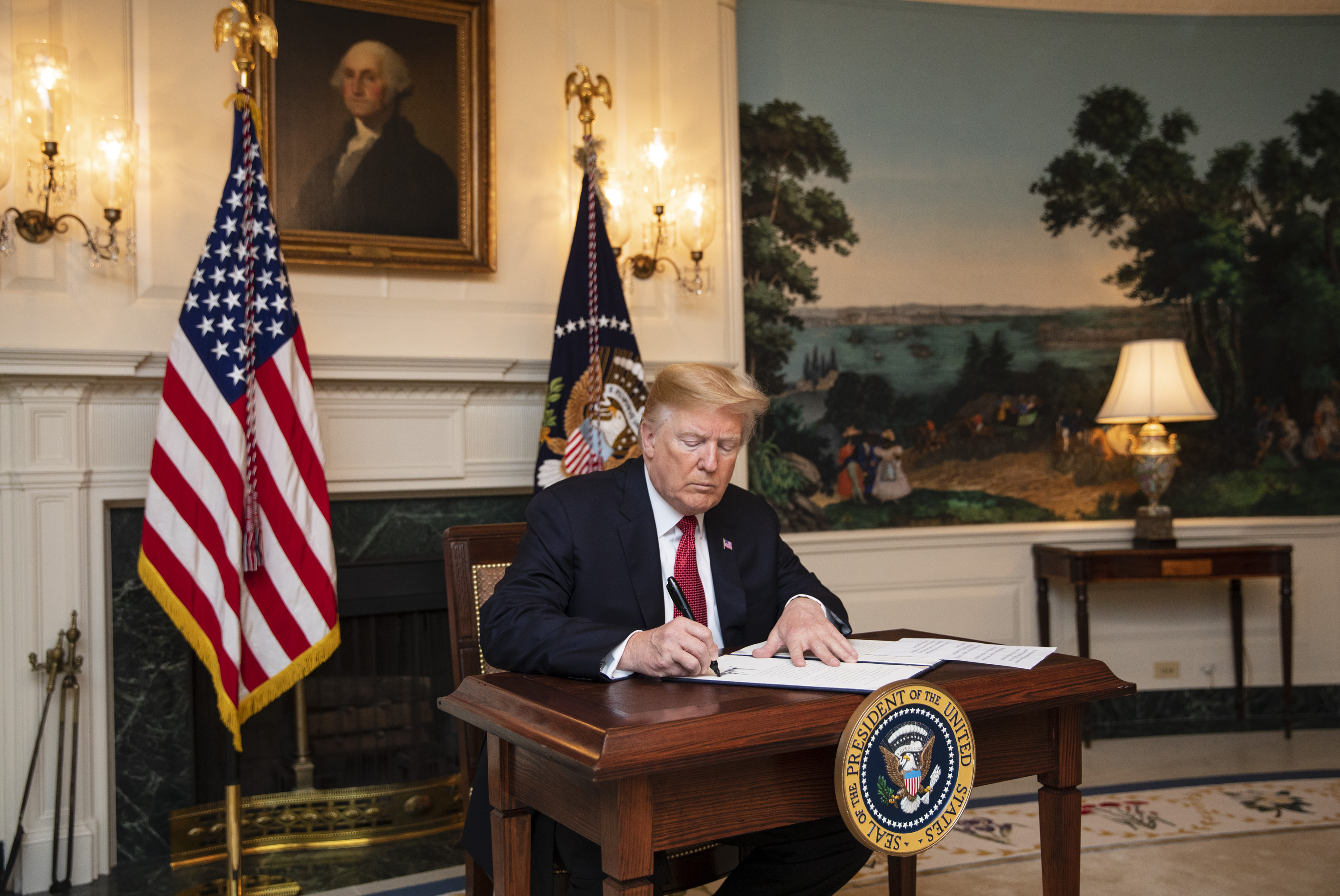 President Trump signs an immigration proclamation.