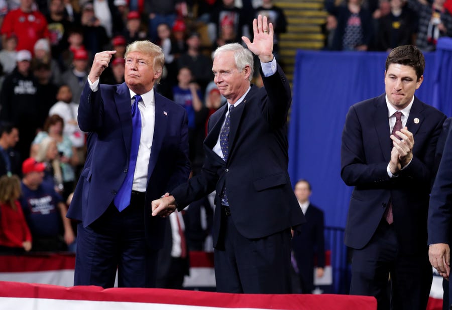 President Donald Trump invites Sen. Ron Johnson to speak after he was introduces at the UW-Milwaukee Panther Arena where the president held a campaign rally in Milwaukee on Tuesday, Jan. 14, 2020.