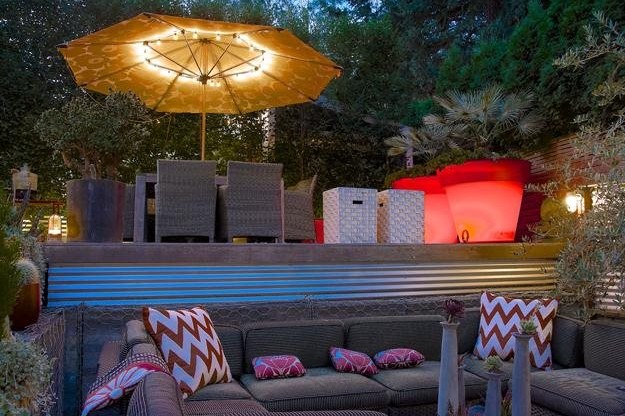 Outdoor tiered patio with lights