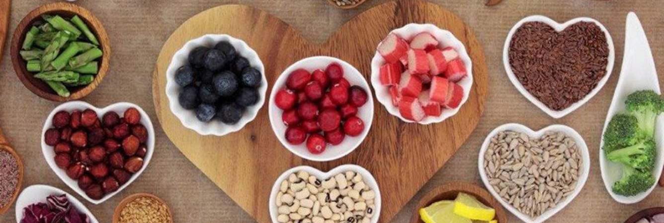 Fruit and vegetables in heart shaped dishes. 