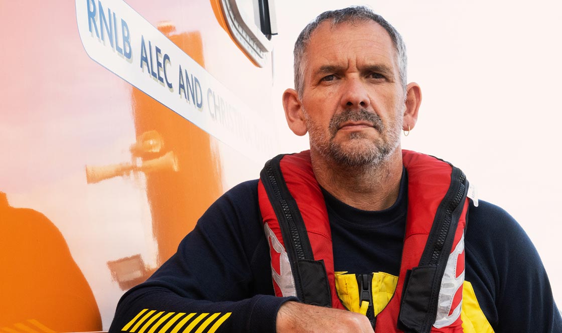 Torbay lifeboat coxswain Mark Criddle speaks with Jeremy Paxman. Photo: RNLI/Nigel Millard