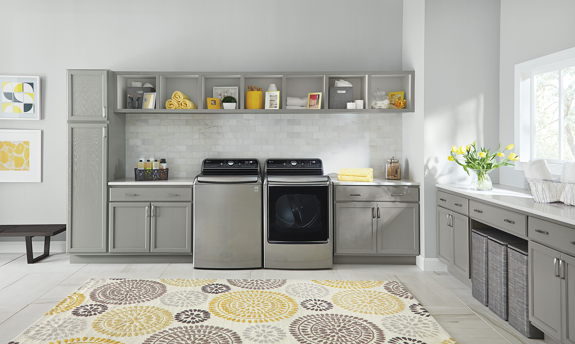 LG washer and dryer in gray and yellow themed laundry room