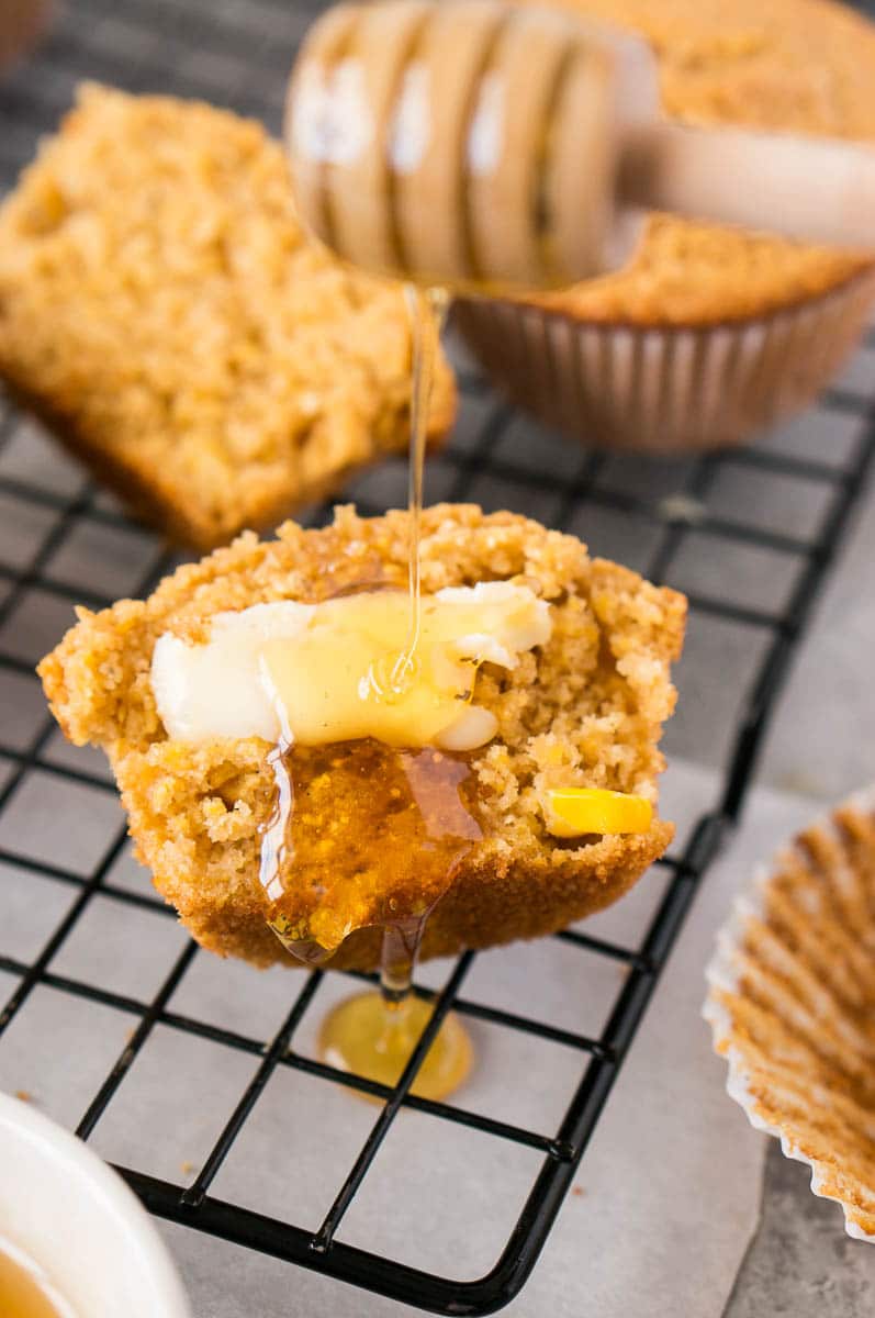 cornbread muffins made gluten-free (on a rack with butter and honey)