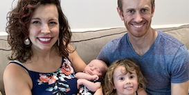 Family of newborn smile at camera  - image