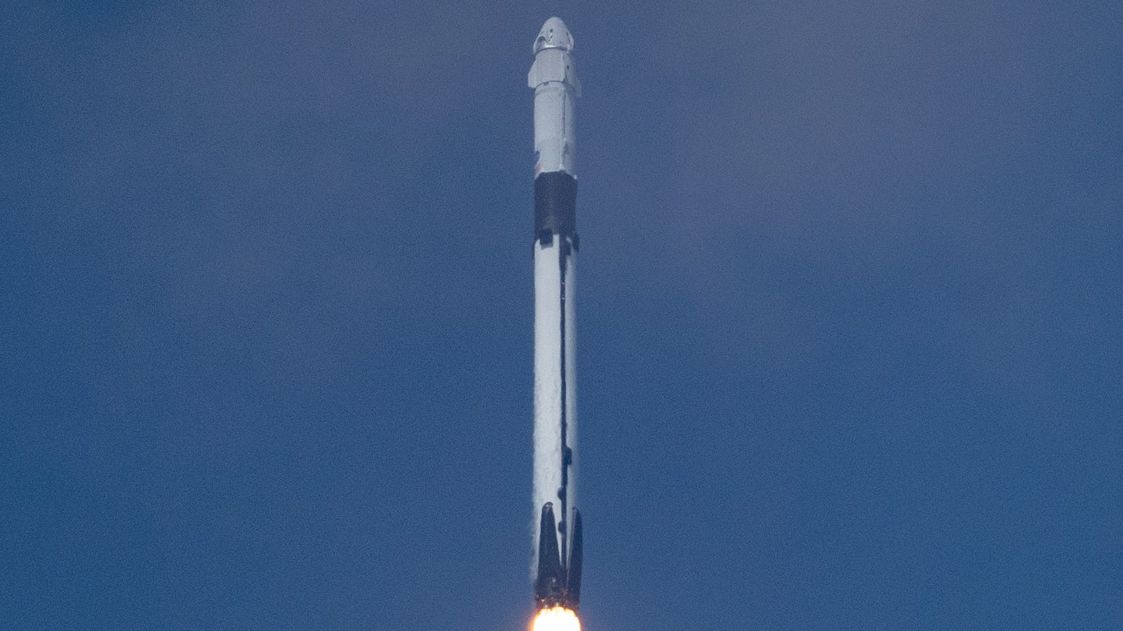 A SpaceX Falcon 9 rocket and Crew Dragon capsule l