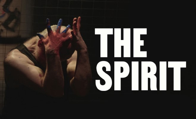 A figure clutches his head in his hands. Blue paint is visible on his fingers. Text: The Spirit