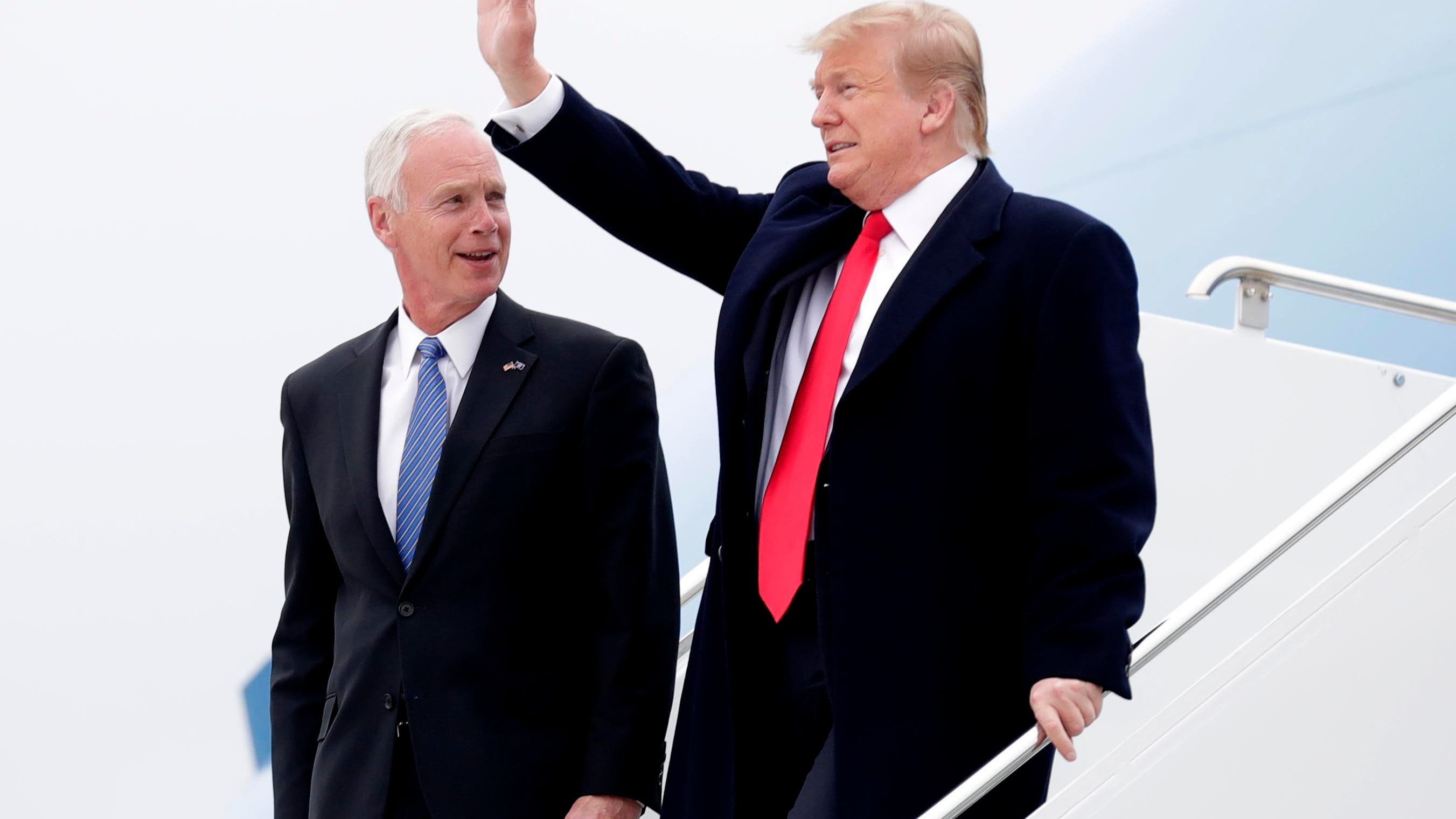 President Donald Trump arrives  with Wisconsin Sen. Ron Johnson to deliver a speech to supporters in Green Bay April 27, 2019.