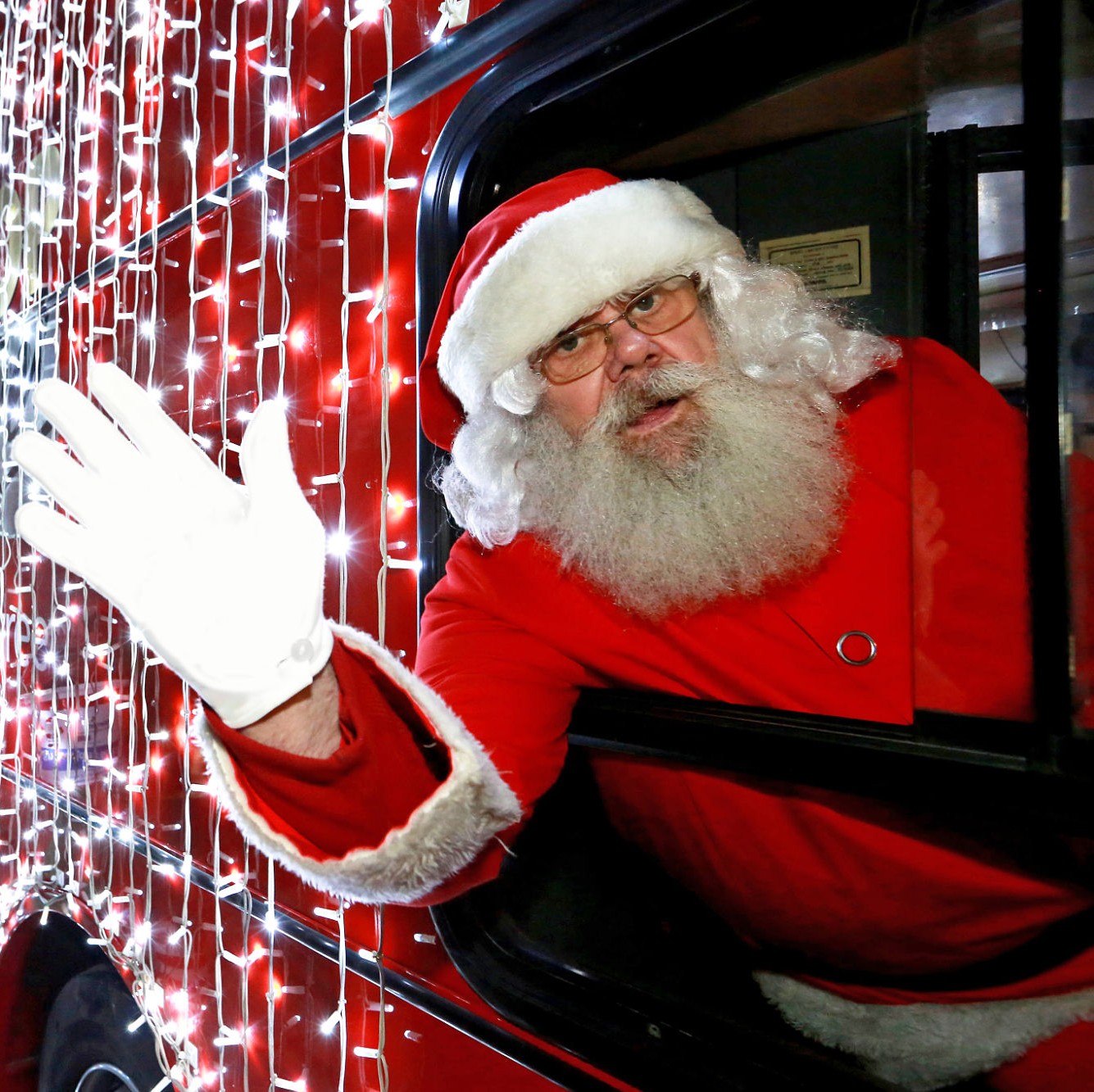 Santa Claus waving from a bus