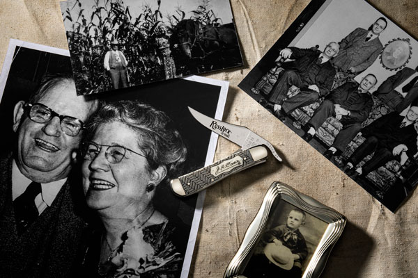 20th Anniversary RussLock knife shown surrounded by images of W.R. Case & Sons Founder John Russell Case.