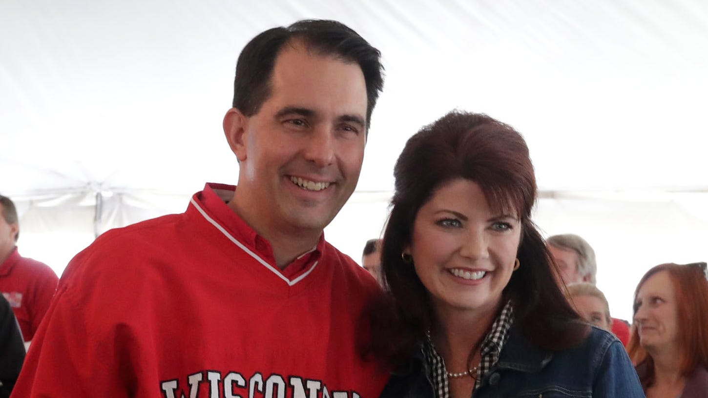 Gov. Scott Walker and Lt. Gov. Rebecca Kleefisch pose for a photo at "Fall Fest," the First Congressional District Republican Party Saturday, Sept. 29, 2018 in Burlington.