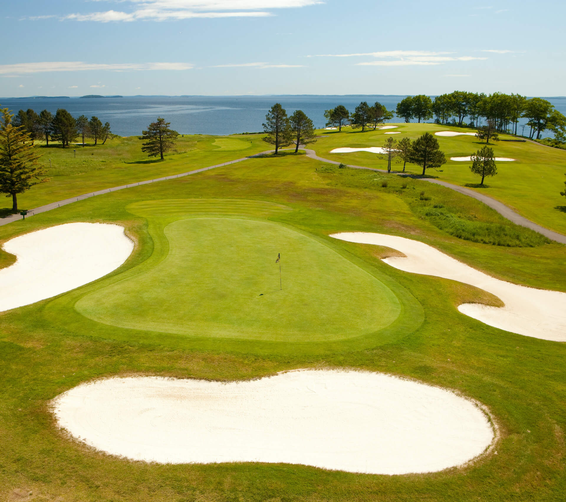 Oceanfront green surrounded by bunkers at Samoset