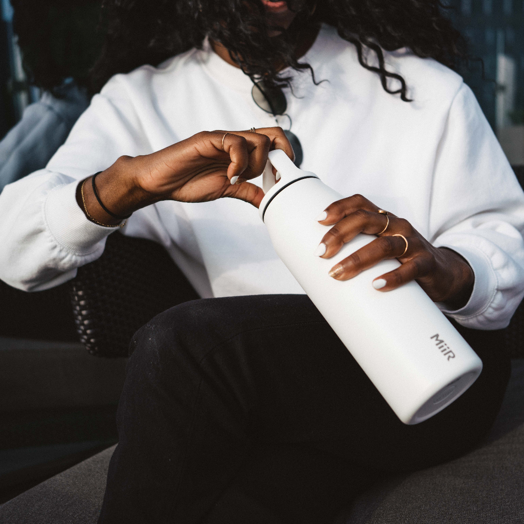 Person holding 32oz Wide Mouth Bottle in White.