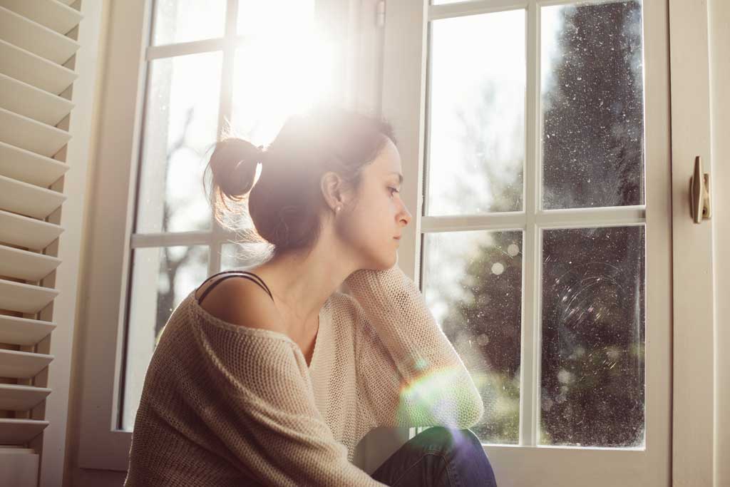Woman looking out of the window