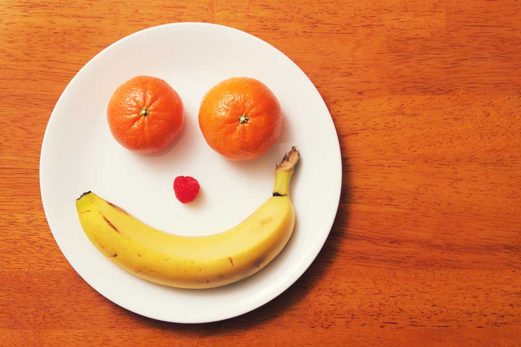 Smiley face made of fruit
