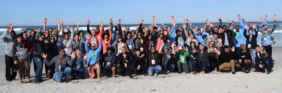 The original cohort of SolarCorps poses on the beach