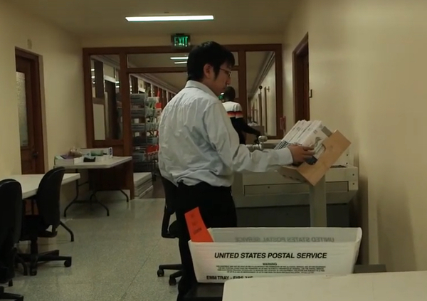 An elections worker processes 2019 ballots at the San Francisco Department of Elections.
