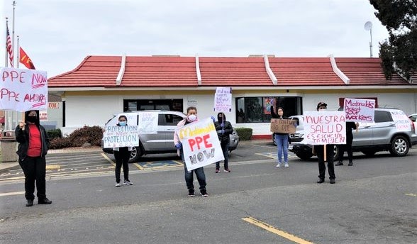 Workers on strike outside a McDonalds.