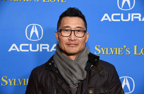 Daniel Dae Kim. Asian-American man with short dark hair wearing dark-rimmed  glasses, black jacket and gray scarf.
