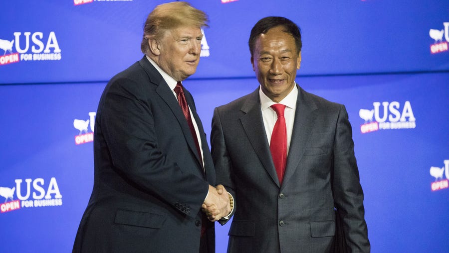 President Donald Trump greets Foxconn chairman Terry Gou  Thursday, June 28, 2018, at the Foxconn Opus Building in Mount Pleasant, Wis.