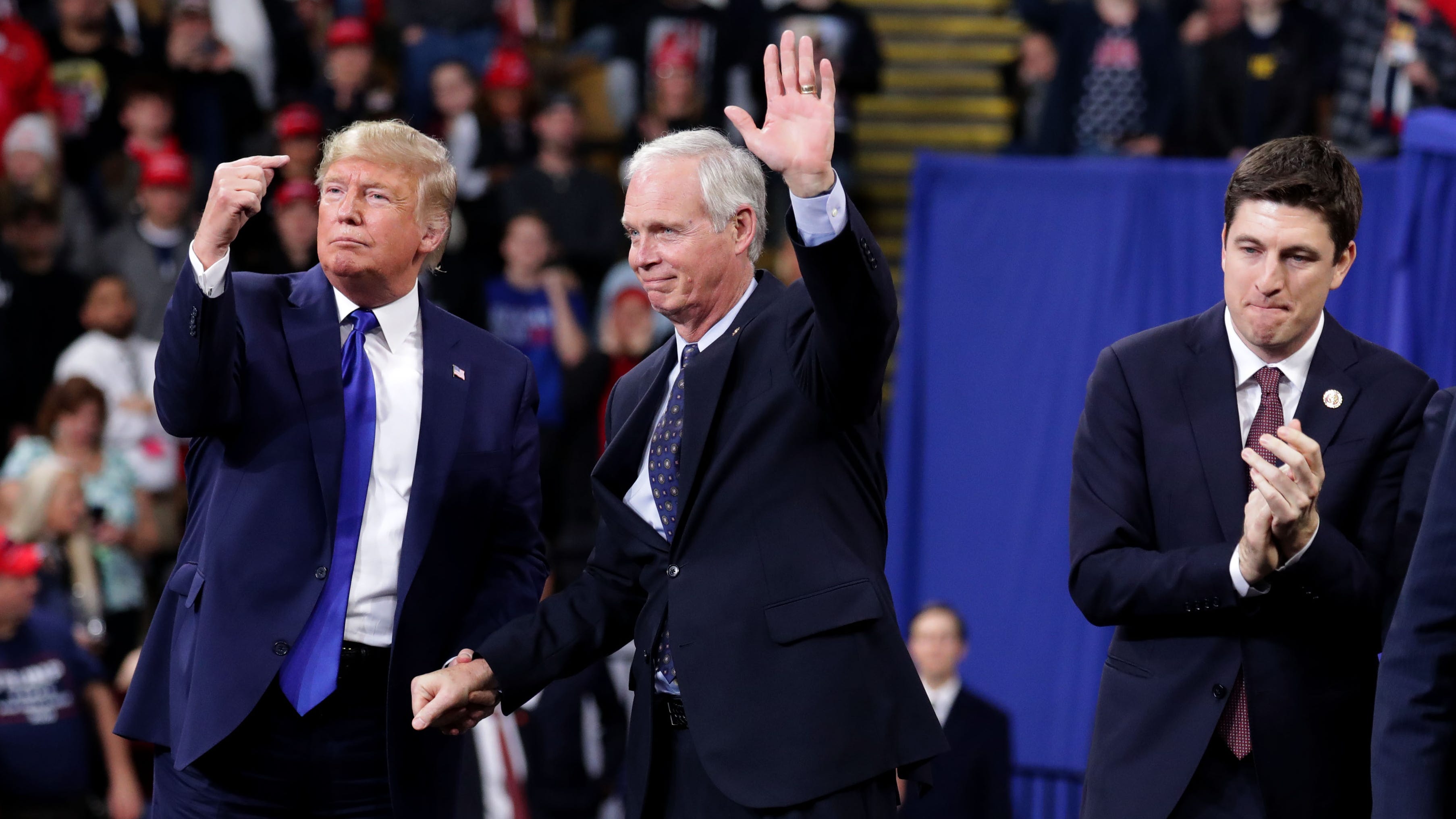 President Donald Trump invites Sen. Ron Johnson to speak after he was introduces at the UW-Milwaukee Panther Arena where the president held a campaign rally in Milwaukee on Tuesday, Jan. 14, 2020.