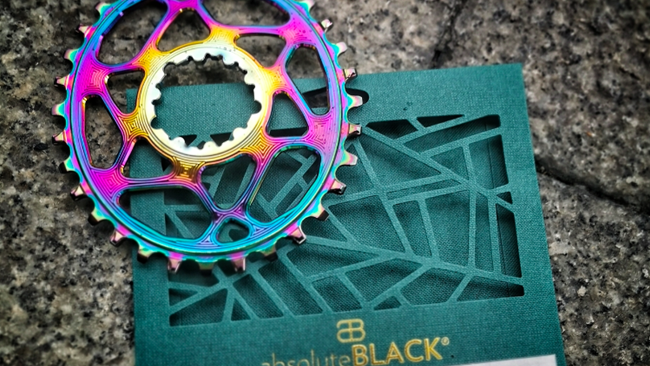 Win 1 of 4 AbsoluteBlack PVD Rainbow Oval chain rings!