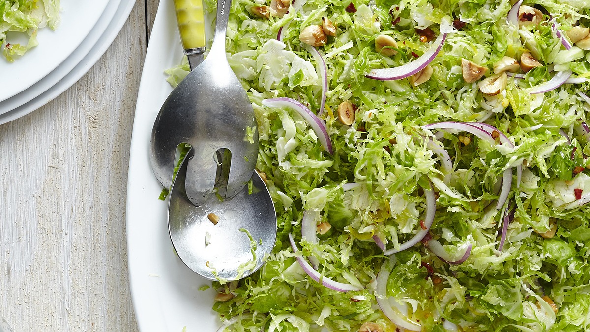 Shaved brussels sprouts salad with lemon-chile vinaigrette and toasted hazelnuts