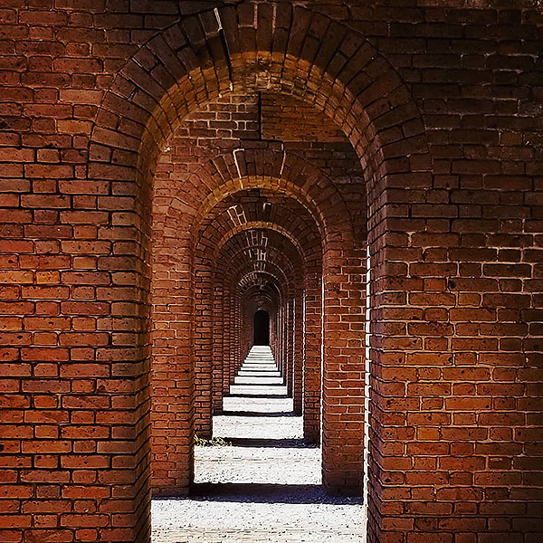 picture of interior of fort jefferson brick wall and arched entries