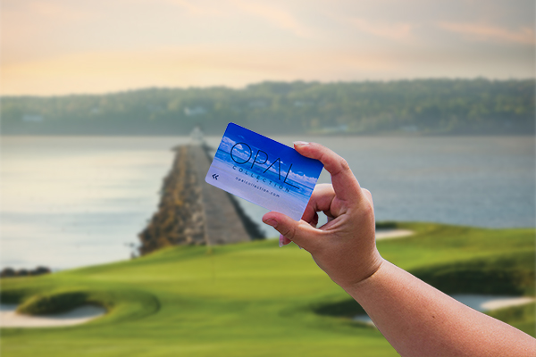 Samoset Resort key card held up with ocean in the background