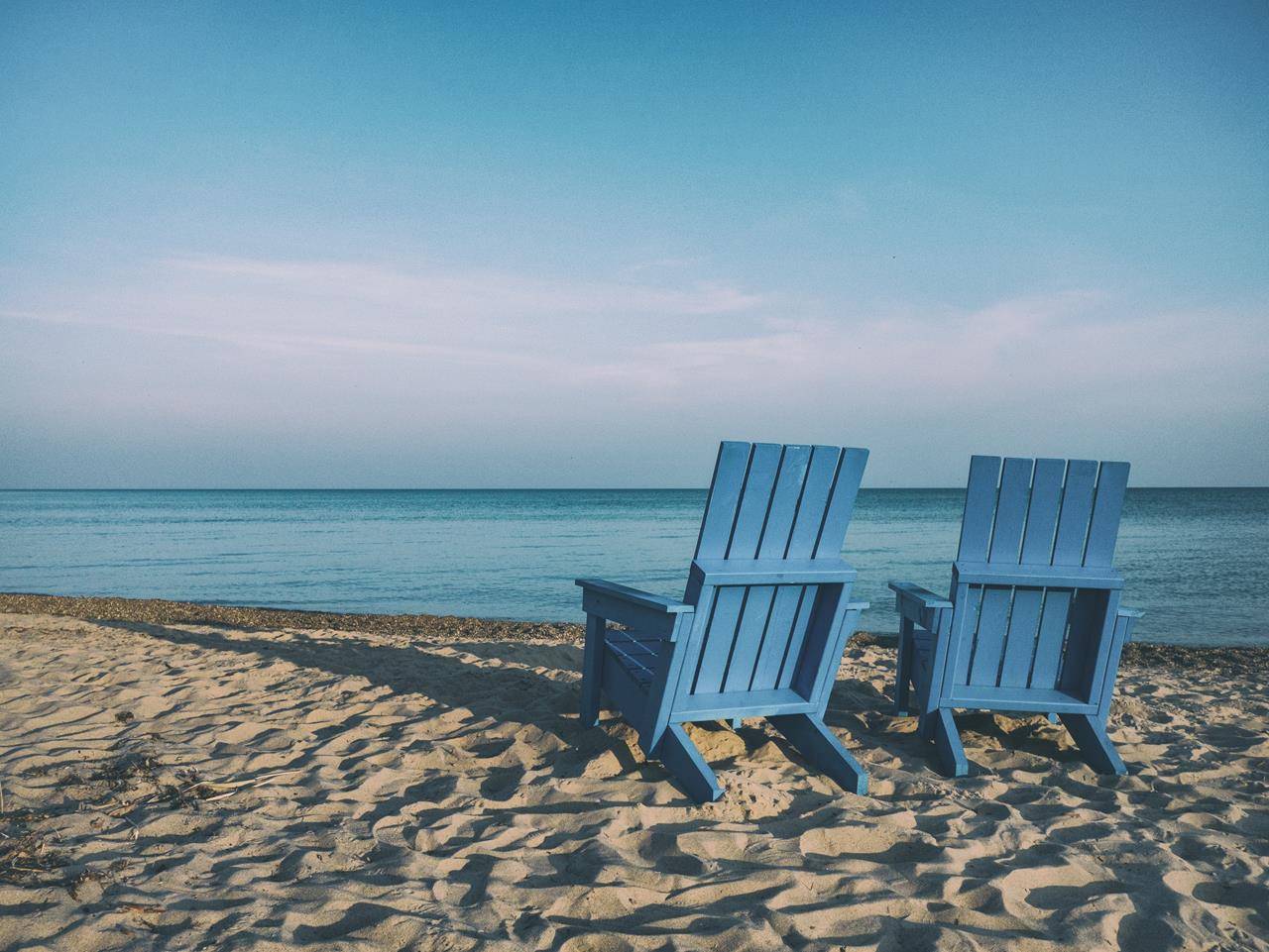 blue chairs on the beach