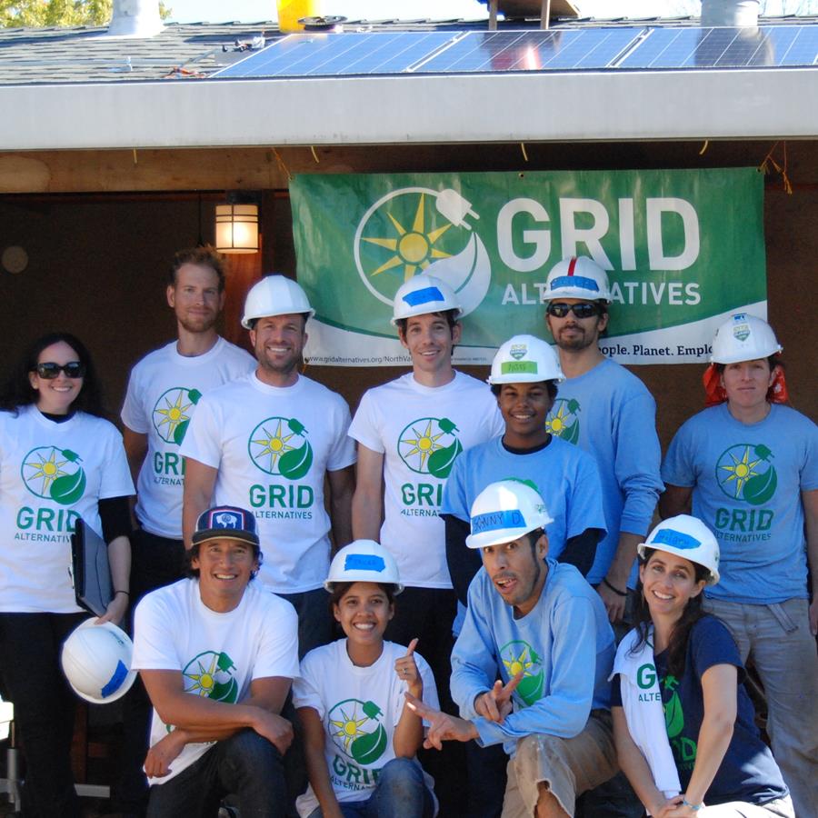 Alex Honnold volunteers at a GRID solar installation