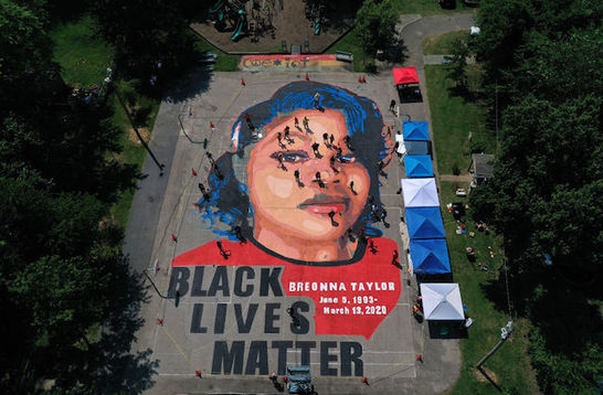 large mural on the ground of Breonna Taylor''s face