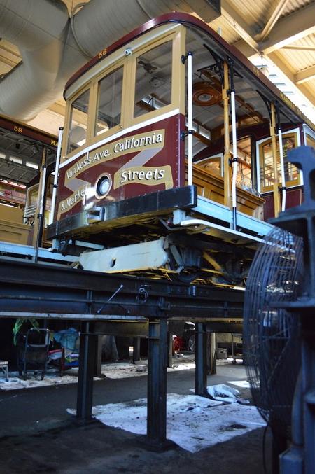 A cable car sits on its tracks waiting to get repairs. Meka Boyle / San Francisco Public Press