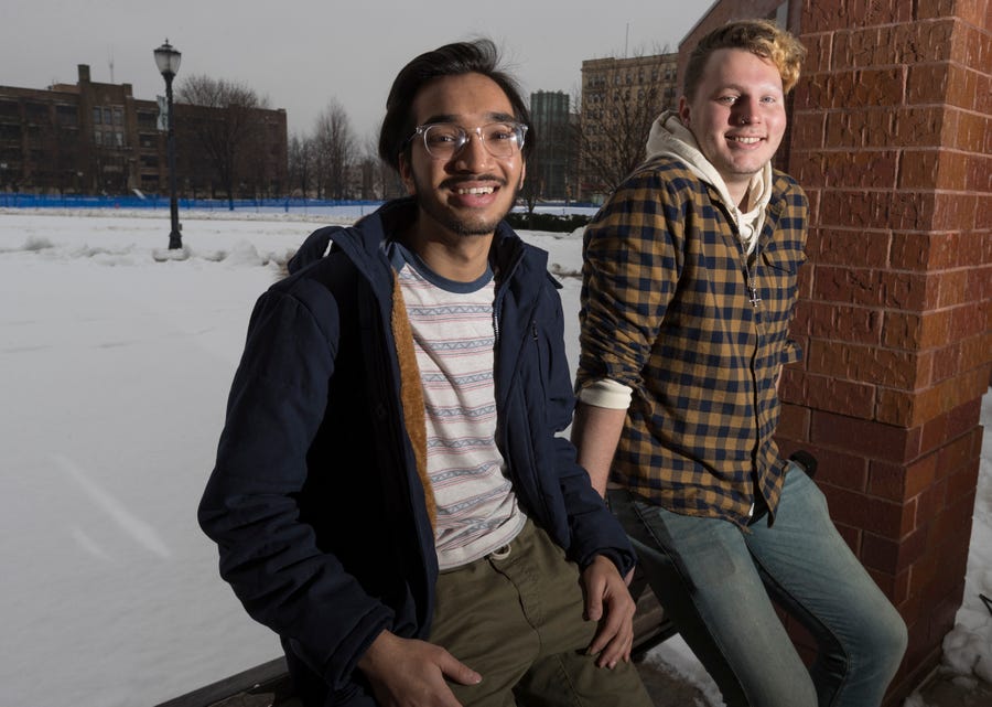 Marquette University students Maaz Ahmed, left, and Eric Rorholm will be taking part in a satellite site for the Iowa caucuses on Feb. 3. They are shown at the university in Milwaukee on  Friday. Ahmed is from Bettendorf, Iowa. Rorholm, of Spokane, Wash., will be a facilitator.