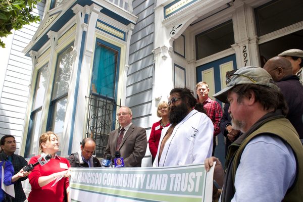 Groups like community land trusts would get the chance to bid on residential properties before they hit the market if a new bill passes in Sacramento. The San Francisco Community Land Trust has established affordable housing in multiple buildings throughout the city, such as 2976 23rd Street, shown here during a 2014 event celebrating its purchase. Photo by Robin Ngai / Public Press