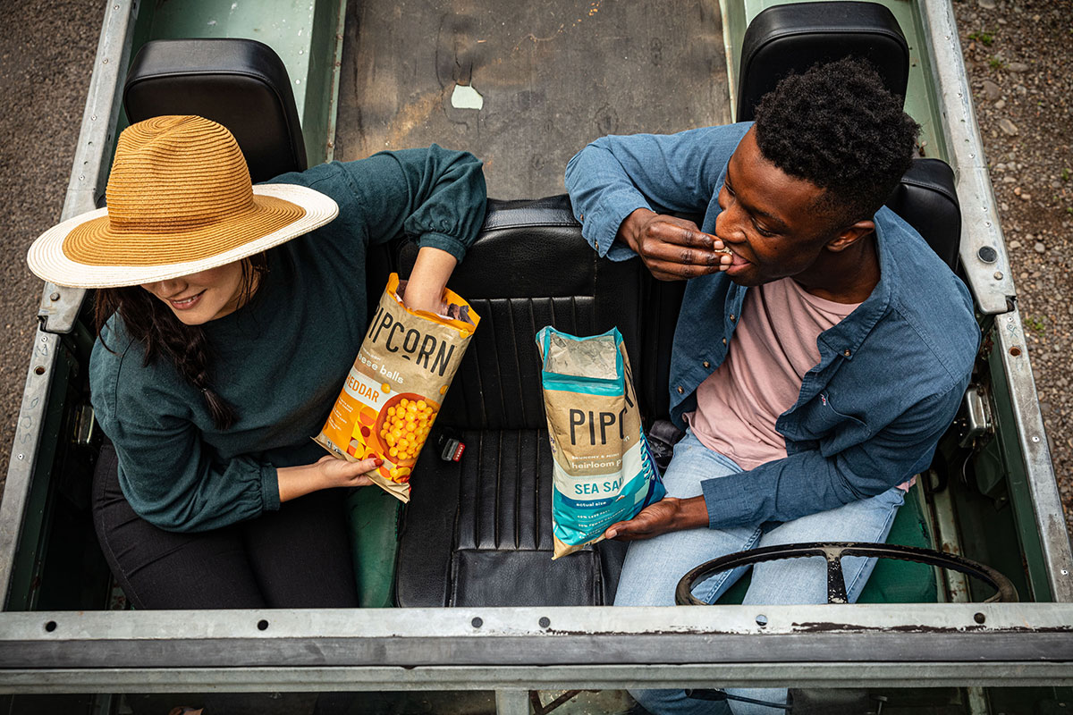 Eating Pipcorn snacks on a road trip