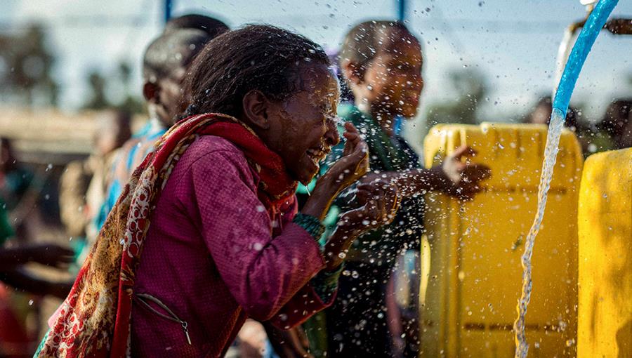 Children drink water in Ethiopia
