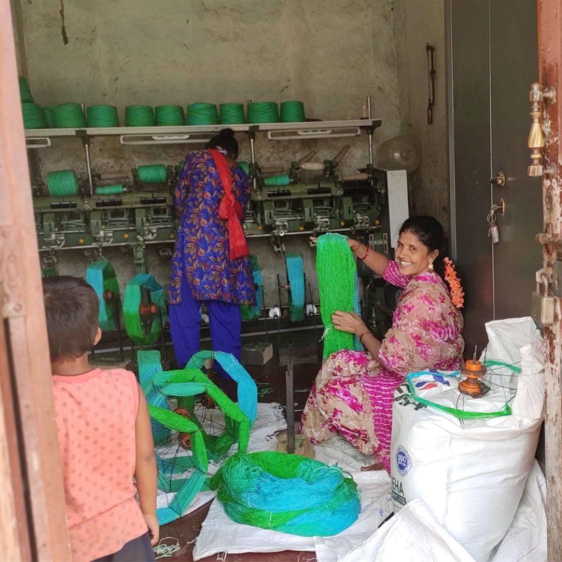 women in india spinning yarn