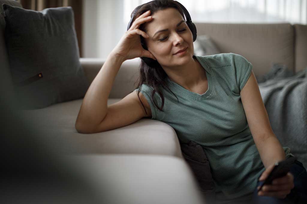 Woman listening to meditation app