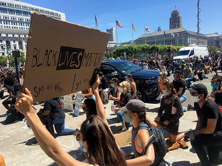 Demonstrators kneel in front of City Hall on June 3. Laura Wenus / Public Press