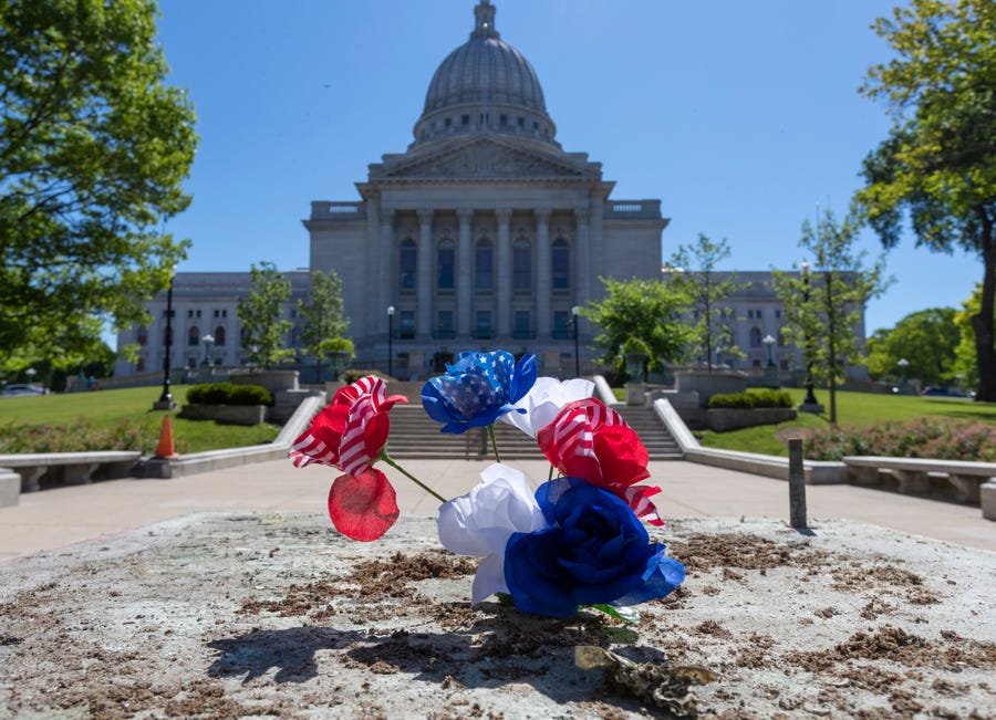 The pedestal where a statue of Forward used to be is shown Wednesday, June 24, 2020 at the Capitol in Madison, Wis. Late Tuesday night protesters smashed windows at the statehouse, attacked a state senator, and tore down two iconic statues.