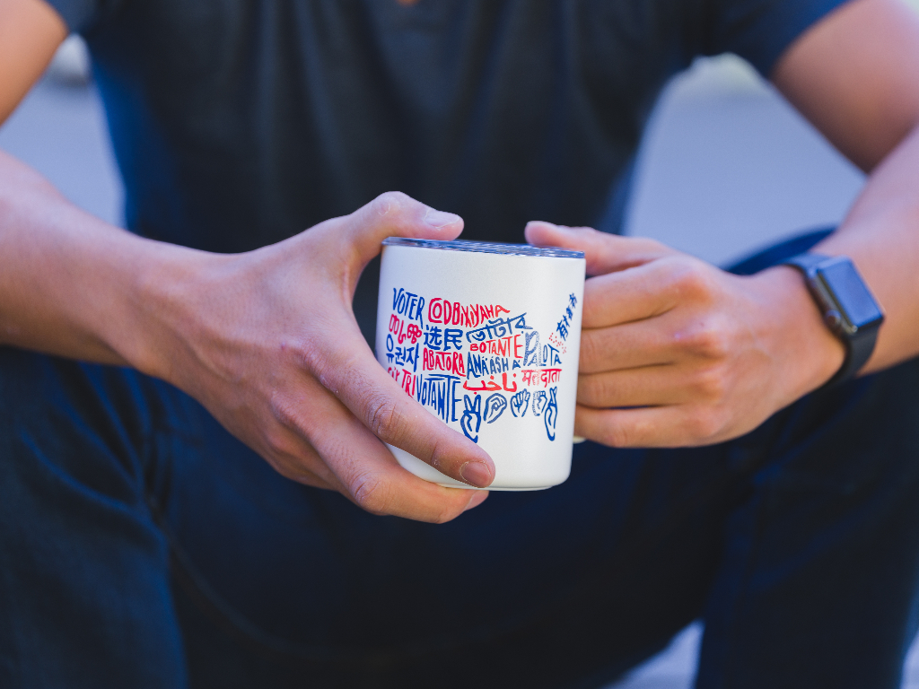 Person holding the Voter Camp Cup.