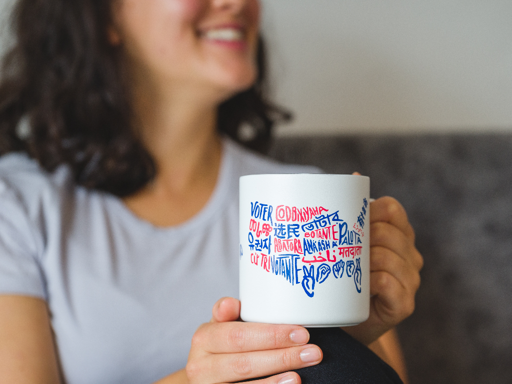 Person holding the Voter Camp Cup.