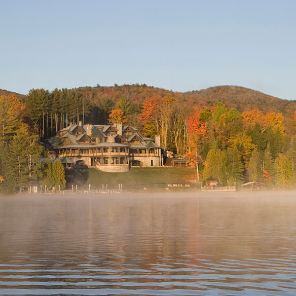 Lake Placid Lodge: A Modern Day Great Camp - Image of a large log mansion on the lake shore