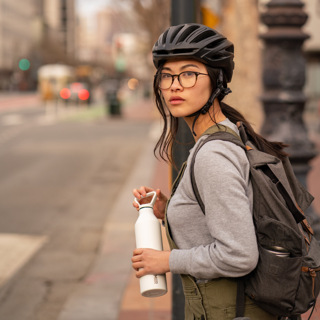 Biker holding 27oz Narrow Mouth Bottle in White