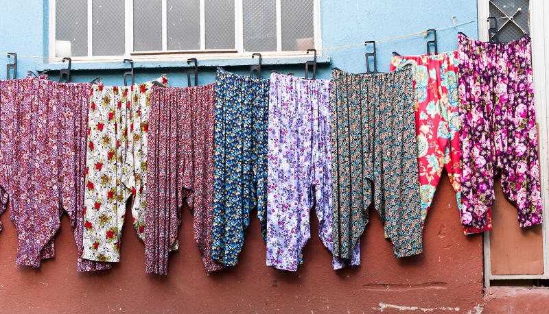 A row of crazy patterned pyjamas.
