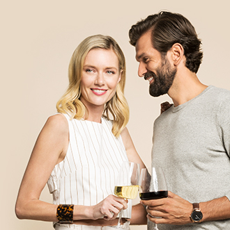 Couple smiling and enjoying wine