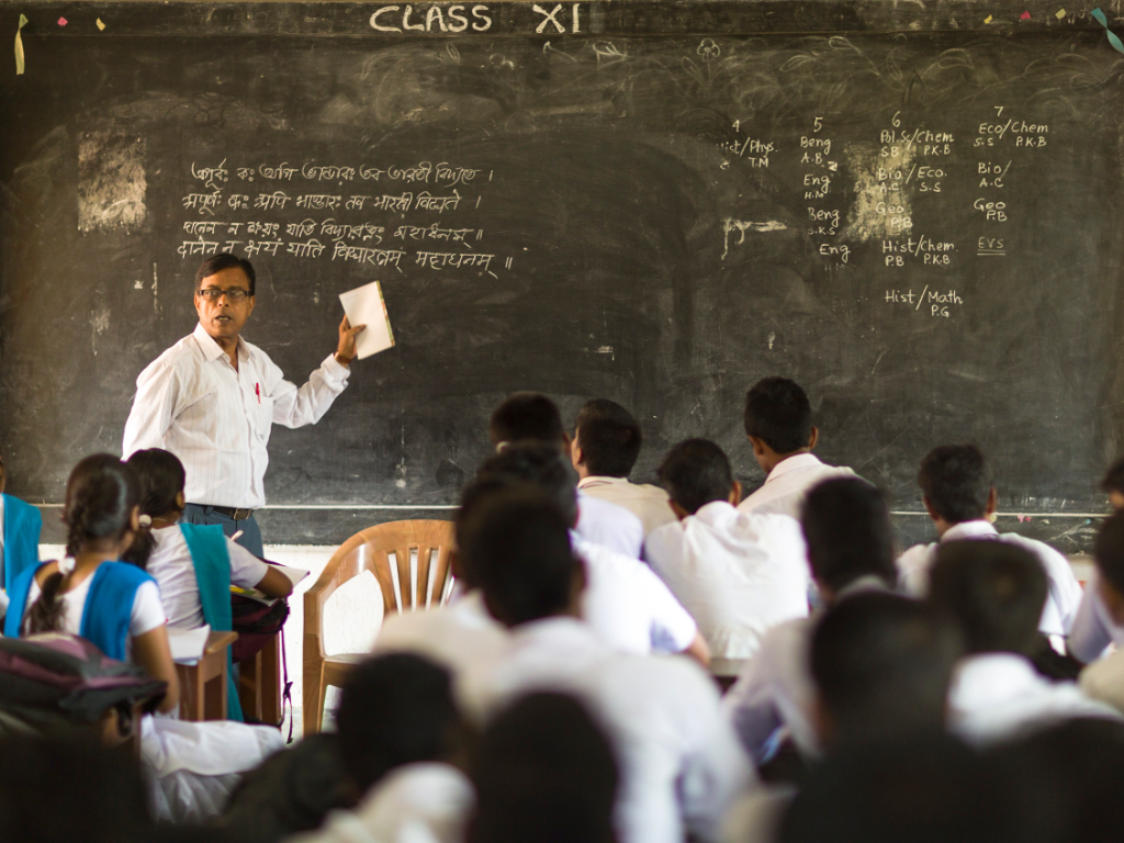 Person teaching students in classroom.